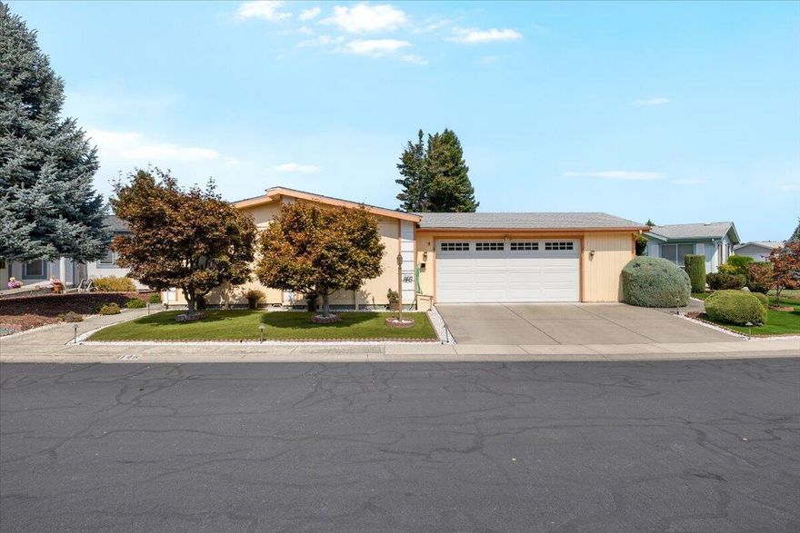 Fantastic Meadows location set on a wide lot with artificial turf front and back for true low-maintenance living. Immaculate inside and out with fresh exterior paint, updated vinyl windows, and a two-car garage with built-in cabinets, pegboard, and opener. Spacious split-bedroom floor plan offers vaulted ceilings, newer laminate flooring, and excellent storage. Kitchen features oak cabinets, hard-surface counters, solar window, and overlooks one of the nicest sunrooms in the subdivision with custom cabinetry, dual ceiling fans, and screened-in porch. Primary suite includes vaulted ceiling, walk-in closet with custom shelving, and updated bath with cultured marble and walk-in shower. Guest bath has tub-shower combo, plus inside laundry with washer, dryer, and cabinets. Heating and air replaced within the last 10 years and polybutylene plumbing removed. Extra detached custom shed included. Beautiful, move-in ready home that is cared for in every detail.