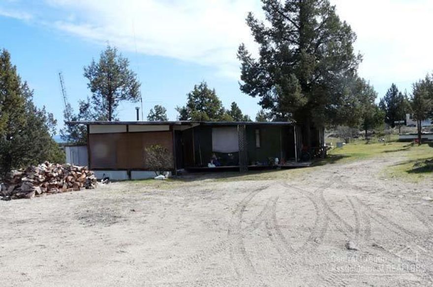 Rustic cabin with killer views and lots of privacy, set back from road and tucked away. 2.90 acres located in the heart of Central Oregon, gated community with private marina access to Metolius River arm of Lake Billy Chinook. All the water sports could ever want, ATV/dirt bike riding, dry desert golf and private gun range for owners and guests.