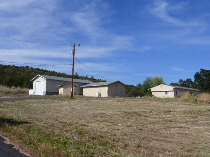 Property offers a fantastic view of the valley. Nicely maintained manufactured home with newer windows and large deck. Land is gently sloped with a paved driveway and large parking area. It has a 24'x60' shop with 20' ceiling, two 16' rollup doors with auto locks. The shop has a partially completed bathroom which was being added for the shop's permitted use as an art studio. Well tested at 24.9 gpm in 2015 and has a newer demand pump and pressure tank installed in 2013. Please contact Listing agent for more information.