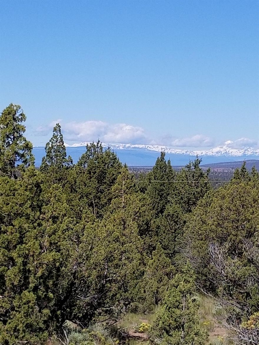 This property is a must see! Out in the country with ample elbow room but it has a paved road to the westward front. There is a Cascade view with pleasant Juniper tree surroundings. There is bordering access to public lands for hiking or riding....right out the Eastern boundary.