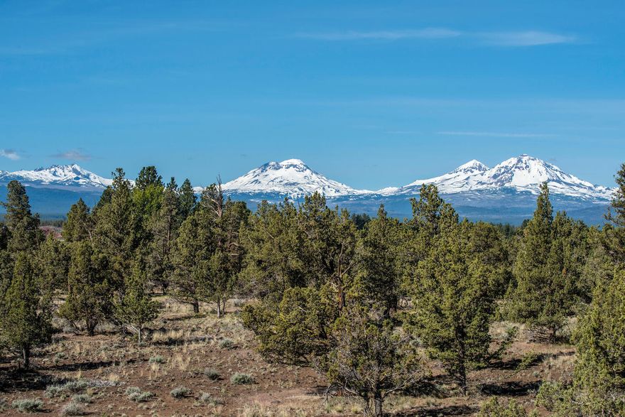 Sweeping Cascade Mountain Views! Enjoy amazing sunrises & sunsets on your own secluded 29.27+/- acres close to the town of Sisters, Oregon. 1,060 SF of living space with a great room, 2 bedrooms + a full bath above a heated 4-car garage/shop, full bath & laundry area. Included stainless kitchen appliances, washer/dryer, and most furnishings. Wrap-around deck has included hot tub. Peaceful, tranquil location with internet/zoom connectivity. 4 acres of 1889 water rights through the Three Sisters Irrigation District. Exclusive Farm Use Zoning allows for horses, cattle, chickens & more! Newer well pump. Approved building envelope to expand the existing structure. New RV/Shop plans negotiable. Private gravel road servicing 3 properties. Sisters School District. Centrally located with easy access to Sisters, Bend and Redmond and all that Central Oregon has to offer. Easy access to Hwy 126 & Hwy 20 to Downtown Sisters (5.9 miles), Bend & Redmond including the Redmond Municipal Airport.