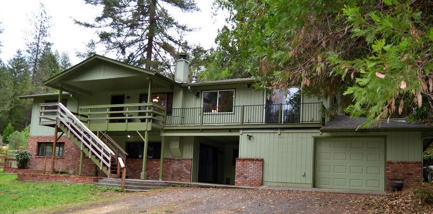 Priced over $117,000 below assessed value, this 5-acre dream property offers incredible potential. The spacious 2,700+ sq.ft. home features 4 bedrooms, 3 baths, and a large garage—ready for your finishing touches to make it shine. Enjoy serene wooded views from every window, a 1,200+ sq.ft. hobby stable, a separate shop, and open meadow and garden spaces surrounded by trees. With a great well and a desirable location among quality homes, this property has all the ingredients to become a stunning private estate. Just bring your imagination and a little love to make it truly exceptional.