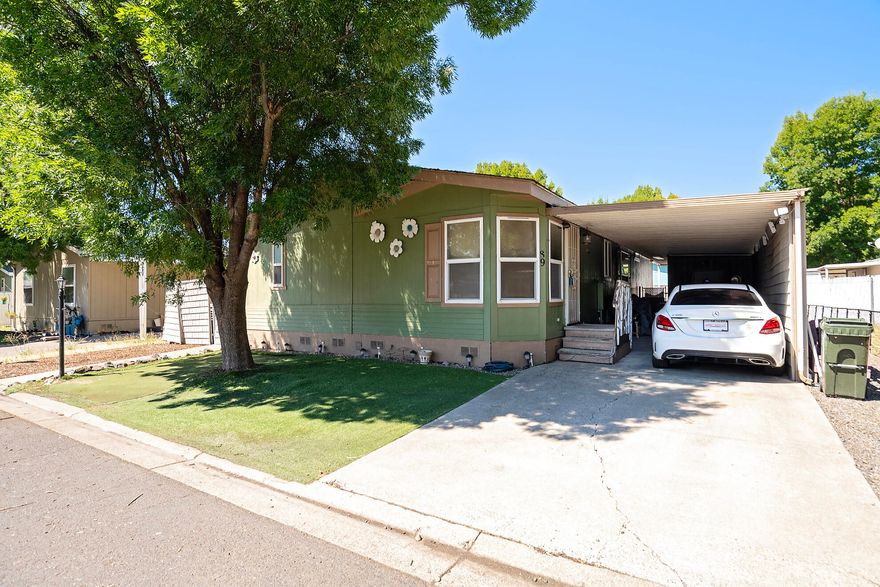 Spacious, Affordable, and Full of Potential!
Welcome to this generously sized 3-bedroom, 2-bath manufactured home located in a well-maintained all-age community that offers fantastic amenities—clubhouse, fitness center, and billiards room all included!

Step inside to an open-concept layout featuring tile flooring, a cozy breakfast nook, and a full-sized dining area perfect for gatherings. The wide carport provides ample parking and includes a convenient storage shed for all your extras.

Whether you're looking for your first home or downsizing with style, this home offers affordability and room to grow. Bring your vision and make it your own!