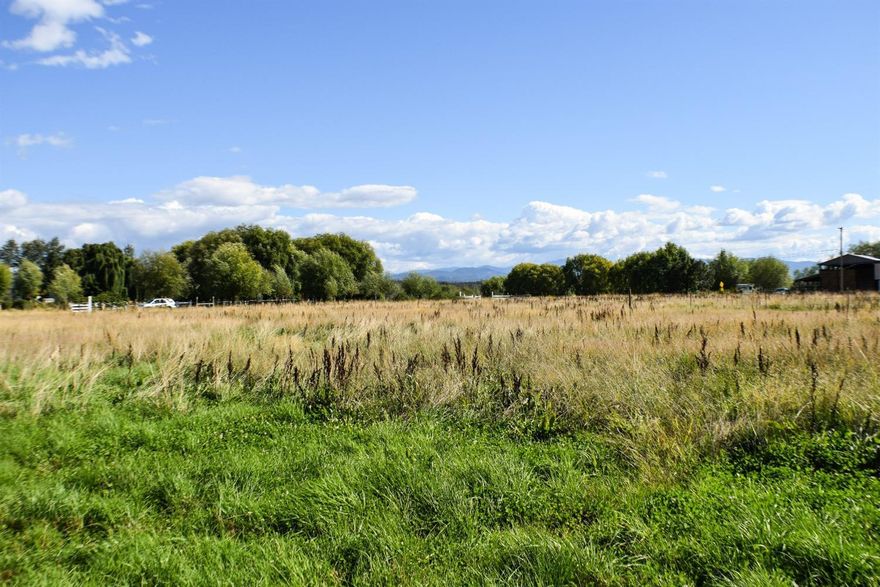 Location and opportunity are just two thoughts that come to mind on this 5.18 irrigation property. Property is zoned RR-5 and the seller has drilled a well (20 gallons a min per well log) has septic approval, power is to the property, home site was discussed with Jackson county planning. You just need to pick the location and bring in the map for county approval. All 5.18 acres are completely usable, with surrounding views of many mountains. The property is ready for your dream home/small farm. Property taxes reflect farm deferral.