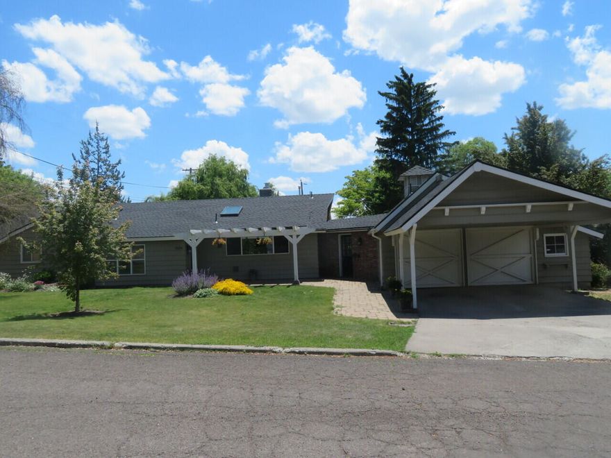 Sprawling rancher full of light and open space. Want to feel like you just walked into the garden as soon as you step foot? This is it! Beautiful kitchen with quartz counters, huge island, gas cooking and double ovens. Great room with dining area and library tucked away in a secret corner. Fireplace to enjoy from all areas of main living area. Bonus room for office/gym/play area? 10x20 shed, with several gardening areas and established trees. Alley access to this 14,237 sq ft. level lot (room to build a shop or ADU). Skylights, recessed lighting, great deck for entertaining. Lots of updates. Super condition.