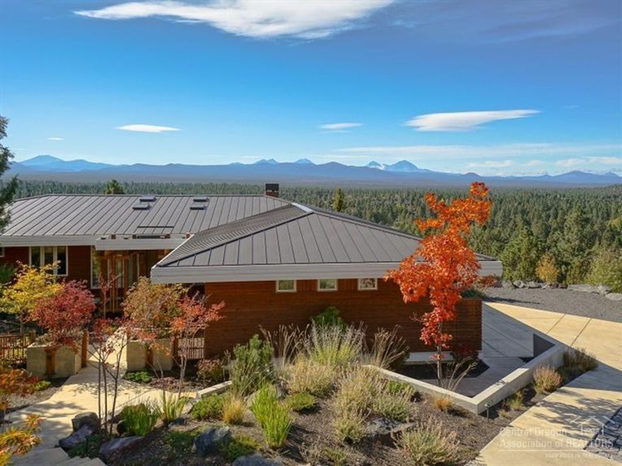 Stunning contemporary home with panoramic Cascade Mountain views from every bedroom, the great room, dining room and kitchen. Gourmet kitchen w/slab granite island, unique designer lighting, rift cut red oak and ceramic flooring plus bathrooms with radiant floor heat. Wonderful outdoor living spaces including a fenced courtyard, endless custom features and incredible attention to detail. Architect Keith Knoll; contractor Hansmann & Sons.