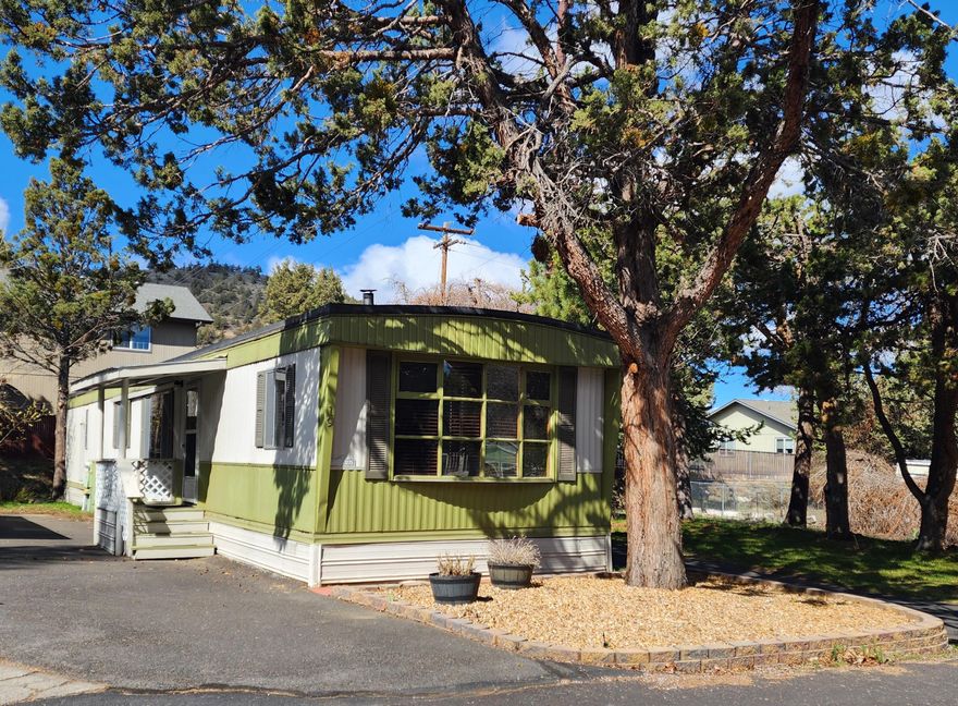 Location, location, location!  Affordable, super cute single wide home in quiet, friendly, 55+ Rock Arbor Villa.  Home located at the back of the park.  Complete interior renovation in 2019, including new furnace, updated light fixtures, bathroom, kitchen with SS appliances, interior paint, and wood laminate floors throughout. Additional updates in 2023 include New Heat pump/AC, custom blinds throughout home, Bosch dishwasher, recessed lighting in kitchen and bathroom, washer and dryer, and exterior area in front of home.  Soaking tub and separate, generous-sized shower in bathroom.  Covered back porch adjacent to carport. 2 sheds for abundant storage.   Space rent is $523/month and includes water/sewer/garbage/street snow removal/indoor seasonal pool and clubhouse.  No dogs.  Sold AS-IS.  Come check out this terrific home!