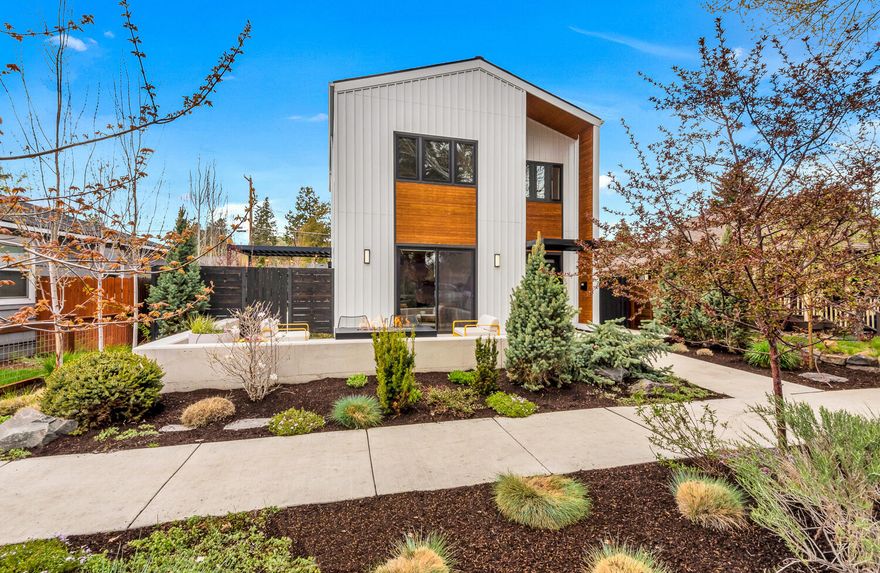 The one you've been waiting for: a modern home in the hub of urban vibrancy! This custom house was thoughtfully designed as a sanctuary for privacy, while still being within walking distance to dining, shopping & downtown Bend. Intentional window placement and tall ceilings capture natural light year round, and the open floor plan allows for every day ease,and all kinds of gatherings. Functional open kitchen with large island, concrete counter tops, built in dish drainer & cutting board, and plenty of storage. An office/media room, mudroom w/dog run access, and half bath round out the main level. Up the sunny staircase you will find two bedrooms, full bathroom, laundry, and spacious primary suite w/two walk-in closets & private deck. Alley access garage has room for two cars + all the Bend gear, and a separate roll-up door gives you quick access to the fully fenced side yard. Space for two extra cars in the alley. Truly a special opportunity to own a pearl in the heart of Bend!