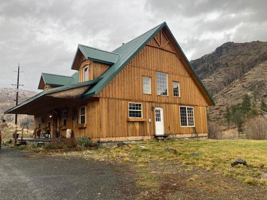 Custom Home On 5+- Acres Up Canyon Creek! Private and peaceful setting, mt and creek views, custom wood work throughout, vaulted ceiling, architectural accents, open floor plan, 3 bedroom 3 bath, office, storage room/potential for 4th bedroom, kitchen w/pantry, dining area, living room, utility w/outside access, covered front stamped concrete porch, mini split heating and ac, laminate flooring, recessed lighting, ceiling fan, vinyl windows, metal roof, partially fenced, shared well, graveled driveway, fiber optics.  $395,000 #1177
(subject to the completion of a minor partition, taxes to be determined)