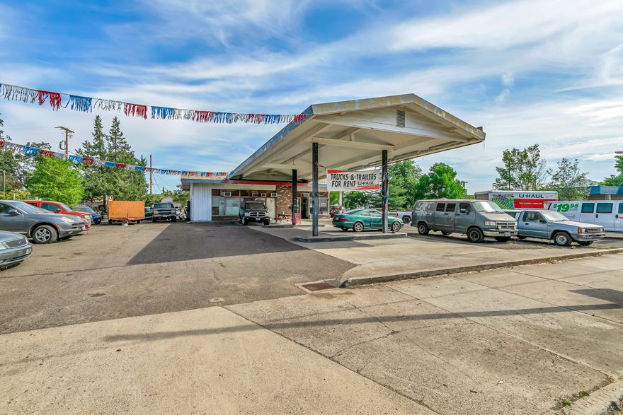 Are you seeking to own a prime commercial corner in West Medford? Search no further. This rare opportunity features a former gas station that's been operating as a car lot for years and currently holds U-Haul equipment. Per the seller, the U-Haul business is possibly transferable (buyers do their own due diligence). The property includes a solid building with two shop lifts, a main office, a secondary office, 2 bathrooms (one working) and ample parking with access from both Main Street and North Orange. (two driveways on Main Street and two driveways on North Orange). The possibilities here are wide open. Start your own car lot, mechanical shop, or other venture. Environmental documents related to the underground tanks are available in the attachments. (DEQ has cleared them) Buyers to do their own due diligence. Property sold as-is and priced for immediate sale.