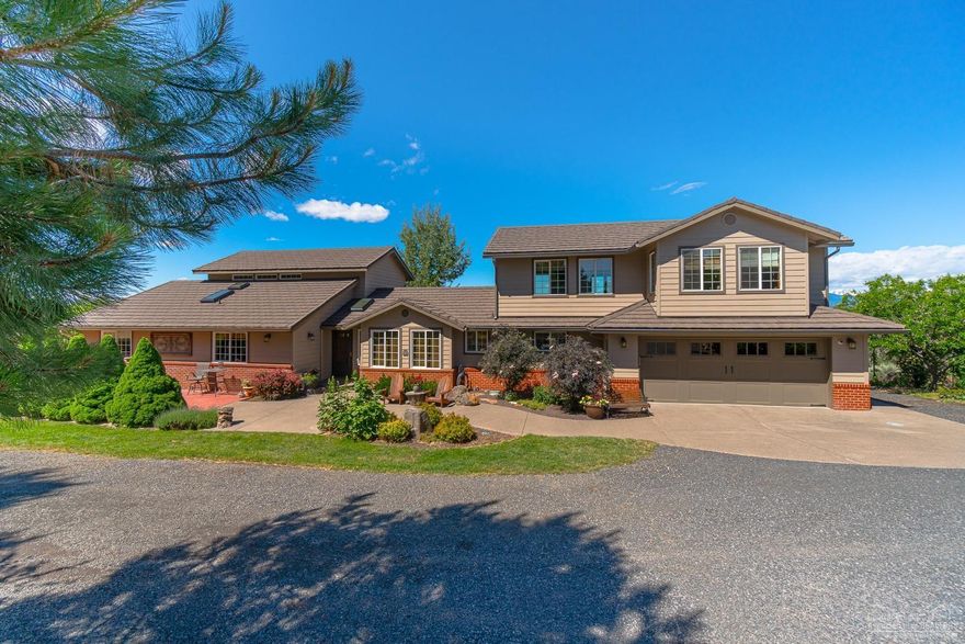 Central Oregon Sanctuary. Located close to town but so quiet, peaceful and beautiful. This property is special, front few acres consists of natural gardens, pond & stream. The back is over 10 acres of pasture, small tree farm, natural areas and a cabin overlooking 2 ponds w/ mountain views. The home has been tastefully updated and enjoys elevated unobstructed Cascade mountain views from almost every room in the home and all the decks. Hiickory cabinets, wood floors, granite, quartz, tile and very open spaces in the floor plan. All appliances and HVAC has been updated. 13000 sf building has riding arena, 60x60 shop area, 3 stalls, wash station and storage rooms. Green house is located in front of the property w/ an area of outdoor raised beds nearby buildings are naturally hidden from the road and home. All landscaping irrigation is automated and underground.