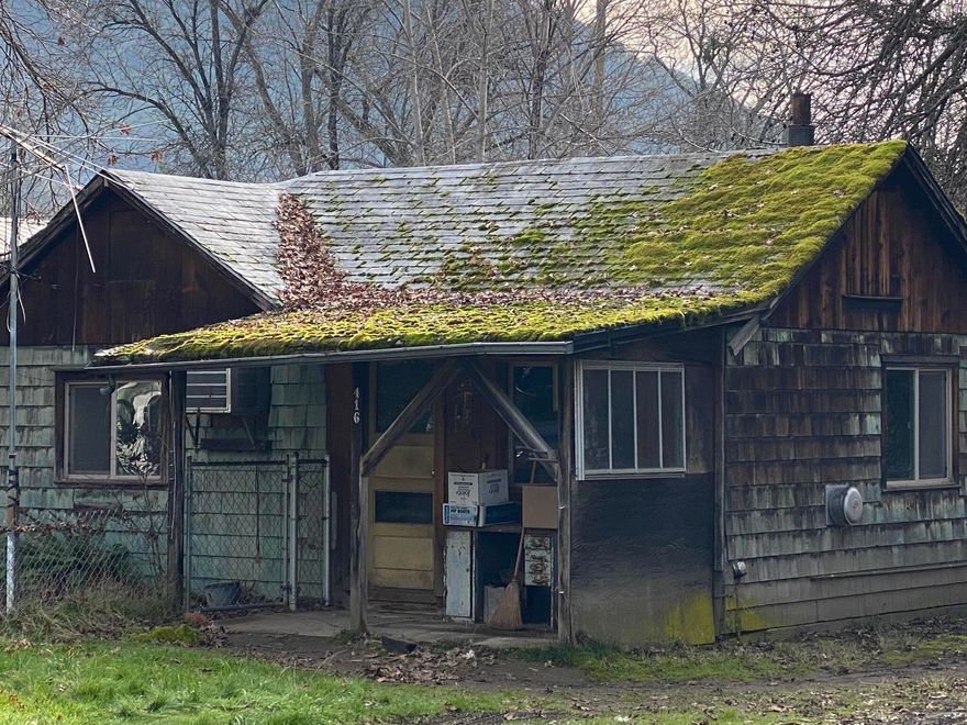 Calling all Investors and cash buyers.  There are endless possibilities here with this 1 bed/1 bath cottage on nearly 1/2 acre in highly sought after Rogue River.  Bring your dreams and a vision.  This 1948 charmer could be restored with room to grow or build anew your dream home in this quaint neighborhood at the end of a cul-de-sac.  All information is deemed reliable but not verified.  Buyer to do their own due diligence into potential use of land.