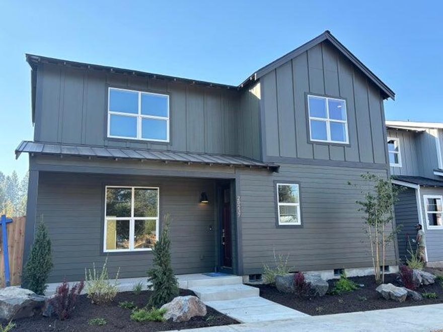 This home, by Stone Bridge Homes NW in Bend's Grand Meadow neighborhood near Riley Ranch Nature Reserve, features a main-level pocket office, two car garage with shop area, and open concept living. The kitchen and great room are light and bright with hardwood flooring, stainless appliances, quartz countertops, and a gas fireplace with a floor-to-ceiling tile. On the second level, you will find a grand primary suite with double vanities, a tile shower, a soaker tub, and a walk-in closet. Two more bedrooms and a bonus room will make a great second gathering area. This home comes equipped with A/C, fencing, and front and back yard landscape and is Earth Advantage certified. The buyer will also receive a 2-10 Home Buyer's warranty certification.