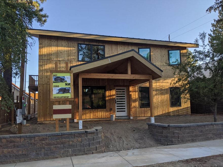 Amazing new home with detached ADU in the heart of NW Bend! This contemporary home offers tasteful design, beautiful finishes, and an excellent floorplan. The main house features a master on the main, great room, SS kitchen appliances (with Wolf induction range), and a 2nd floor loft with 2 bedrooms and a full bath. The 1 bed/1 bath ADU has dedicated off-street parking and a large deck, perched above a 2 car garage with additional storage - the perfect income producing rental unit or private retreat for your guests. Designed to be extremely energy efficient, this home will be certified a ''Net Zero'' home through Earth Advantage, meaning it's designed to generate as much energy as it uses over the course of a year! The excellent location boasts a ''walkability'' score of 80/100, with easy access to both downtown Bend and westside trails and amenities. A unique opportunity to have the efficient home of your dreams, and an income producing rental unit, all in a great NW Bend location.