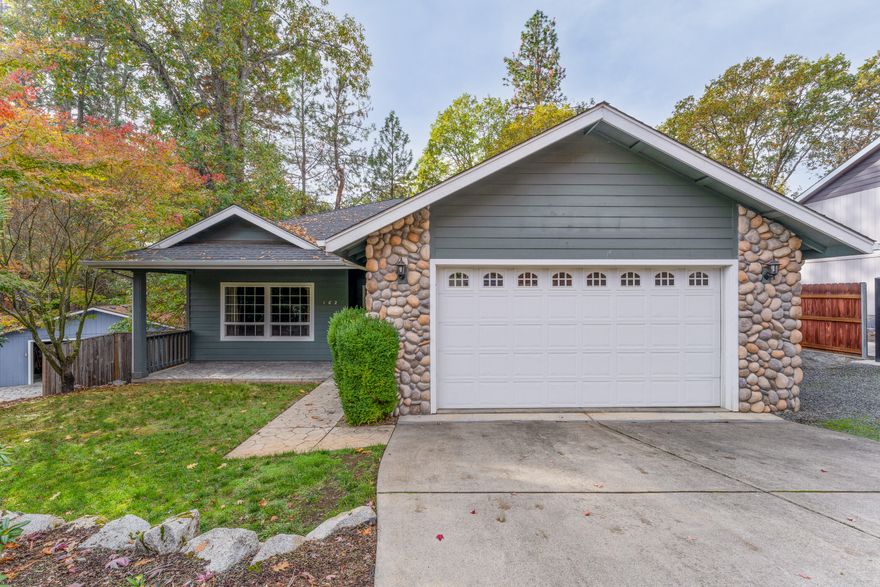 Now VACANT! This wonderful home sits in a quiet cul-de-sac in the heart of Rogue River. With 3 bedrooms, 2 baths and an easy to love floorplan- this house will truly suit any buyer! The living room has a large window that showcases the private front yard and mature landscaping, as well as a gas fireplace to keep your winters cozy. Follow the hardwood flooring to the dining area + kitchen equipped with stainless steel appliances and beautiful warm cabinetry offering plenty of storage space. Primary suite is located off of the dining area and features a walk-in closet and bathroom with a separate tub/ shower + a dual sink vanity. Two guest bedrooms, a guest bath, and an additional office nook with built-ins make up the remainder of the home. Out the back slider you will be greeted with a spacious wood deck + hot tub that overlook the low maintenance backyard. Amazing floor to ceiling cabinetry in the garage + additional storage space in the basement. Call today to tour this lovely home!