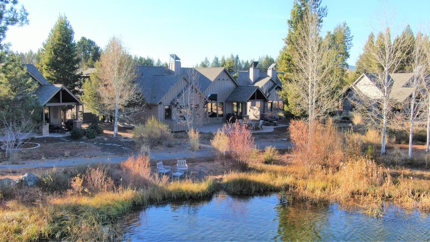 Lakefront cabin in a prime location across from the Quarry Pool and Fitness Center! Caldera Cabin 21 is the perfect vacation home with a peaceful setting close to all the amenities Caldera Springs has to offer - Lake House, Quarry Pool, sports court and Caldera Links golf. This spacious cabin design includes four on-suite bedrooms, a full-sized den/office and five bathrooms. The upstairs suite includes a family room area, with built-in bunks and a full bath. Fireplace with handmade solid wood mantel provides ambiance and warmth for family gatherings.  Master suite takes advantage of view of Obsidian Lake while remaining private. In addition to its upscale interiors, this home also offers scenic views of the lake. BBQ on the large lakeside patio which also includes a fire-pit. Relax in your hot tub after a long day of skiing on the mountain or hop on your bike and explore miles of bike paths and trails. Two car garage with plenty of storage. Offered fully furnished.