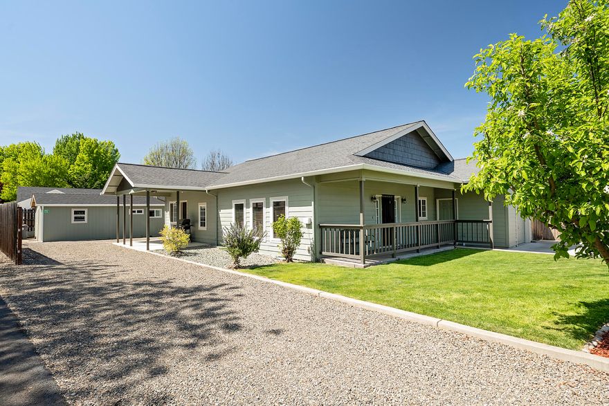 Discover the perfect two-family setup or an exceptional investment property with two houses on one tax lot! The front home boasts 1,674 sq ft of spacious living, featuring 3 bedrooms and 2 baths, two generous living areas, and a dining room that flows seamlessly into the open-concept kitchen with a charming breakfast bar. You'll love the exposed wood vaulted ceilings and rich wood accents throughout, creating a warm and inviting atmosphere. Between the homes there is RV parking with hookups. The back house is a 1 bed, 1 bath suite complete with a bonus sitting room/office and a private patio, perfect for extended family, guests, or tenants. Recent updates include a new roof, updated HVAC system, and several replaced windows. There's even a separate storage structure with plumbing and electrical offering endless possibilities for a studio or workshop. This unique property offers a strong investment potential—don't miss your chance to own this one-of-a-kind opportunity!