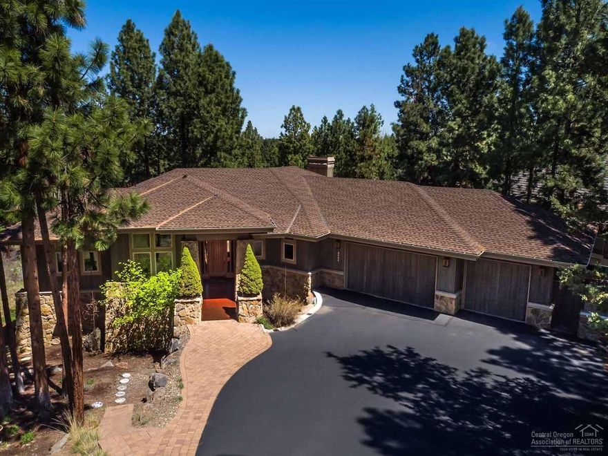 Overlooking the 9th tee box, this Awbrey Glen home is set back on a .45-acre lot with beautiful golf course views. Inside, stunning red birch floors & luxurious finishes are featured throughout, including solid granite counters & alder cabinets. Wood accents make this home warm & inviting. Main level master suite with a gas fireplace; two additional bedrooms & a family room with a wet bar are on the lower level. This home is filled with many wonderful amenities & is only a short distance to Downtown Bend.