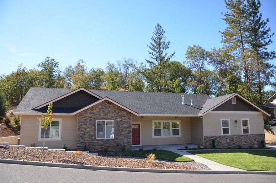 Brand new 2015 home with 1938 sq ft 3 bedroom 2 bath home on .23 of an acre with a 3 car garage. Open floor plan with wood throughout. Living room boasts a gas fireplace, vaulted ceilings and a TV hardwired into the wall. Covered back patio and front porch. This home is located in a newer upscale subdivision and will go fast. There is a 10 year warranty on the home that is transferable to new owner.