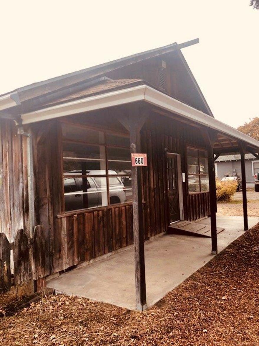 You may remember when, Red would sit outside on his tractor and wave to all the passing cars and people! You too can be a part of this sweet history. This is The Childers Property and ready for your new business. Bring your ideas and head on down to work with the great people at city planning and breath some life back into this building, adding to our quaint Jacksonville community. An attached living space with it's own entrance, one wouldn't have to go far for work! Location is key with great exposure, a circle driveway and parking. The property has a large outbuilding/shop/garage/storage area with gas heat. Come tour today! (Property is being sold in an estate sale)