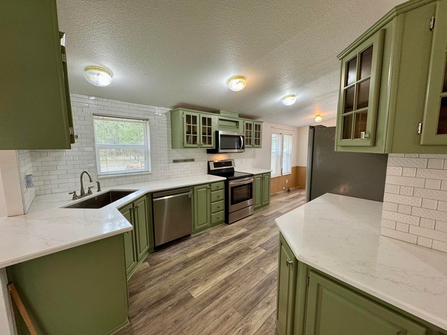 Explore the potential of this 1999 manufactured home, featuring 3 bedrooms and 2 bathrooms within a comfortable 1320 sq ft layout. The property includes a detached double car garage on a spacious 1.42-acre lot, offering plenty of room for outdoor activities. Landscaped with sprinkler system, and backyard fully fenced, providing a safe space for children and pets. New Roof in 2023. Additionally, the paved driveway comes with RV parking, making it convenient for travel enthusiasts. This home presents a wonderful opportunity for customization and personal touches—perfect for your ideal living space!