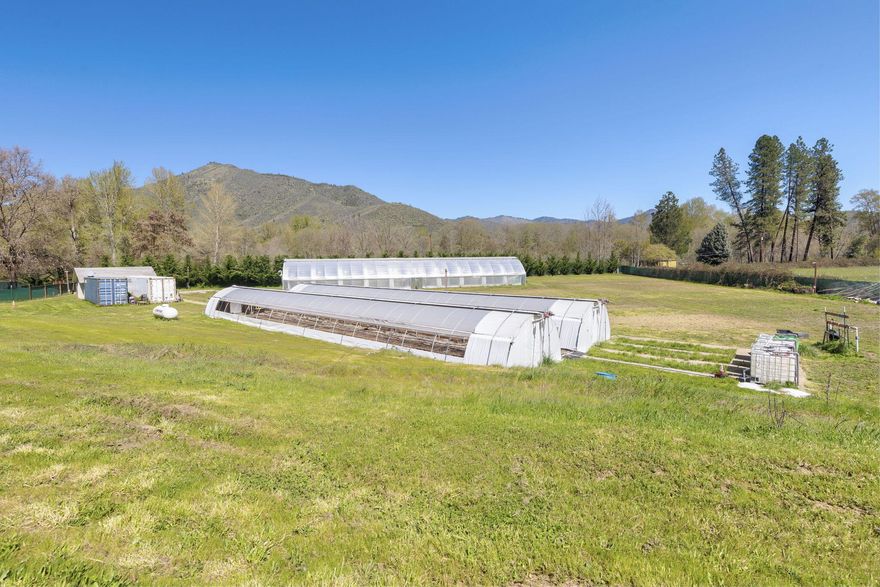 Lavish & Serene EFU Parcel! 2.42 Irrigated acres! Strong 1916 irrigation rights + supplemental water rights for drought yrs., Fully fenced! Perfect for your own large garden or animals! Property includes One 24x120 'State of the Art 'internal dep GH+2 fully automated 16x96 cold frame GH w/light deprivation. 450sf storage bldg.  complete with concrete flooring and electrical. 40ft insulated Hi cube shipping containers & several water tanks visible on property. OLCC Producer 
Licensed & equipment's to be sold separately. Option to buy together Tax Lot 400 offers a lovely Home includes (1)Manufactured home on 2.32ac with strong Well. Call for details & schedule a tour today!
