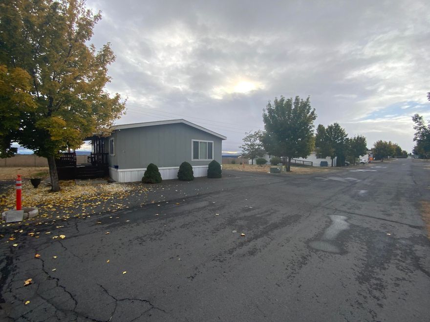 Manufactured home in park . Large Clean double wide 3 bedroom 2 bath . Fenced back yard with shed . Main Bedroom has nice size bath . Dishwasher and stove included in sale . Nice Large deck 4-5 years old .