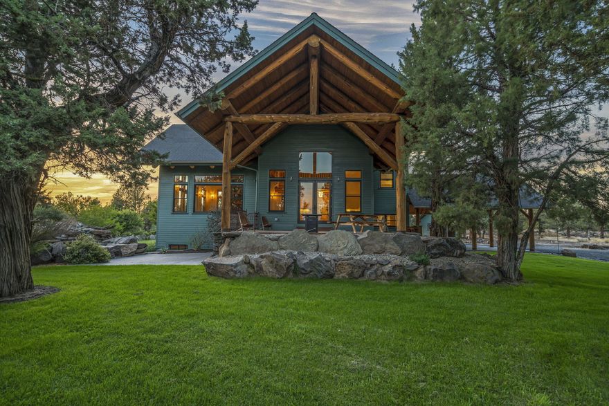 Fantastic Cascade Mountain Views from this gorgeous 4 bedroom home located on over 6 acres between Bend and Sisters! Step inside this meticulously crafted custom home with soaring ceilings, beautiful hardwood floors, large windows and tons of natural light flooding in. The spacious kitchen offers granite tile countertops and Siberian Red Birch cabinets as well as a large breakfast bar. Enjoy meals in the sizeable dining area, or dine alfresco on the covered porch which overlooks the massive water feature! This home offers a lovely primary suite- Complete with large walk-in closet, tiled shower and double vanities- As well as a junior suite on the main level and two additional basement bedrooms. Additional living space in the daylight basement and charming loft that looks out to the mountains. Outside you will find an attached carport, shed, large barn and detached 2-car garage, as well as additional water/electric/septic hookups, perfect for RV parking or room to build a shop. Near BLM.