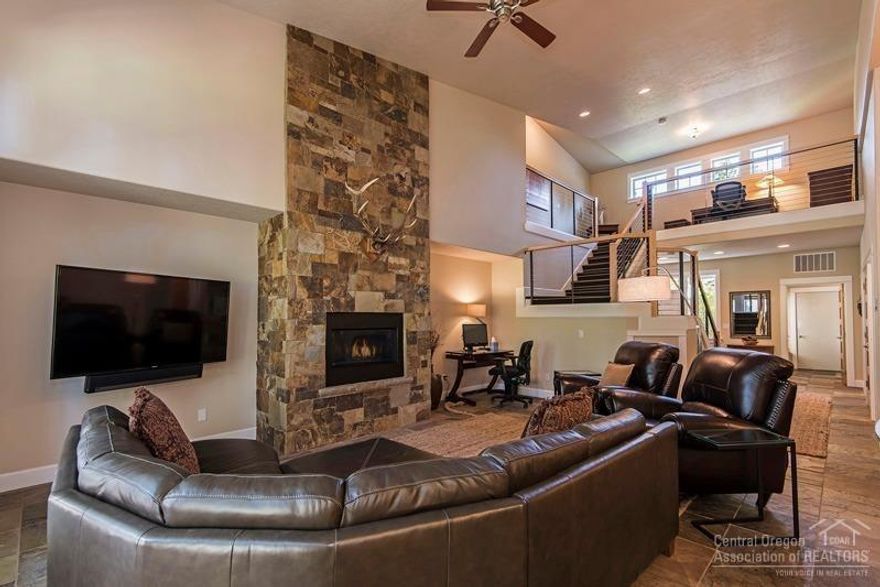 Elegant 3 Bedroom Widgi Creek townhome seamlessly blends warm & cozy with sleek sophistication. Fully furnished & updated home features an open great room with floor to ceiling rock fireplace, slate and wood flooring, an updated gourmet kitchen, complete with high-end appliances including Viking refrigerator, new dishwasher, composite sink and stainless-steel counters. An open staircase with high tech cable railing leads to spacious loft office with lovely golf course and pine tree views. The combination of two master suites and a full en-suite guest room along with the prime location just minutes from the slopes of Mt Bachelor, a short walk to the Deschutes River and Golf literally out your back door, make this the perfect full-time residence or home-away-from home that can be rented as a long or short-term vacation rental when you are away