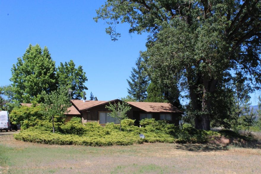 With great soils and lots of sun, this property is laid out well for a variety of uses. A large open space up front will give you lots of space for a vegetable garden, and the larger pasture behind the home is a great size for horses or small agricultural operation. With EF zoning, the possibilities are endless. The 3 bedroom, 2 bathroom home is comfortably laid out and has an oversized attached garage. In addition, there is a small detached shop or garage located behind the home, close to the pasture.