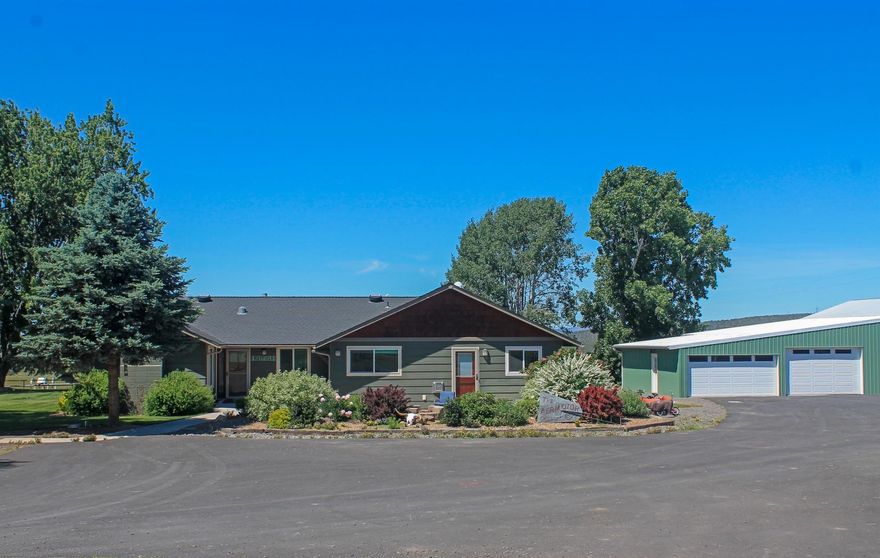 Beautifully updated home on 14.66 acres w/13 irrigated acres, set up for easy maintenance with 2 wheel lines & k line, fenced and cross fenced with an alley from front to back pastures. Stunning views of the Cascades and Smith Rocks. Open great room with stacked rock accents, gorgeous kitchen with huge island, master suite w/steam
shower, in-law suite with fireplace, bonus room w/fireplace currently used as a bedroom, huge laundry room & mudroom. Detached 3 car garage, barn, loafing sheds &
chicken coop, 30 x 30 shop w/3 stalls off the back, full RV hookup, paved driveway.