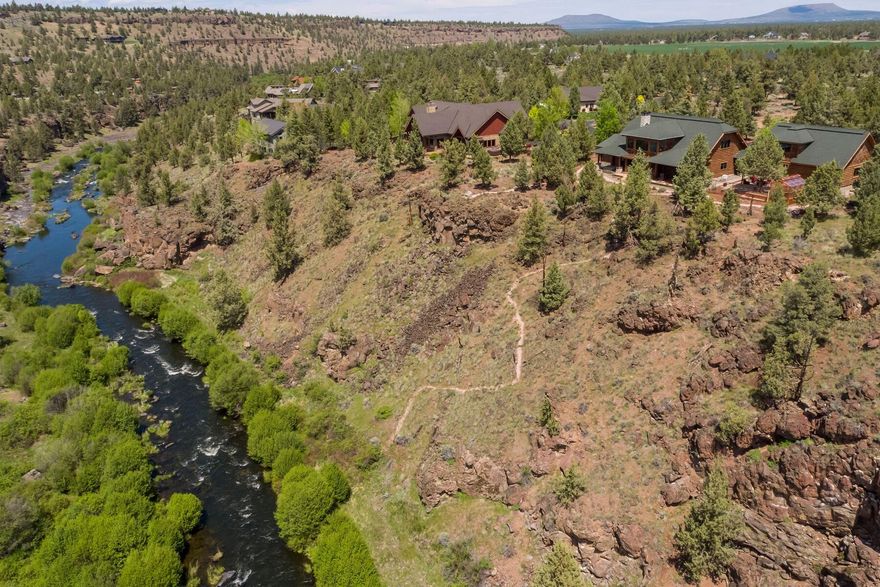 Deschutes Riverfront custom home with Cascade Mountain Views and river access. This Craftsman style log home is 3856 sq ft, 3 bedroom suites, master bedroom with sitting room, fire place, jacuzzi tub, walkin tile shower and private access to cover deck and hot tub. Great room with vaulted ceilings, 30 ft' river rock gas fireplace. The chef's kitchen has quarter sawn oak cabinets, quartz countertops, wet bar, pantry, dining room and access to outdoor kitchen. Library/office, upstairs family room loft, utility room, 2 car garage, 13' RV garage bay and 500 sq ft 4th bedroom/office suite upstairs. Landscaped yard, two water features, ponds, paver patio with gazebo, 96 sq ft greenhouse and raised bed garden. This is one of kind property with a private setting and stunning views.