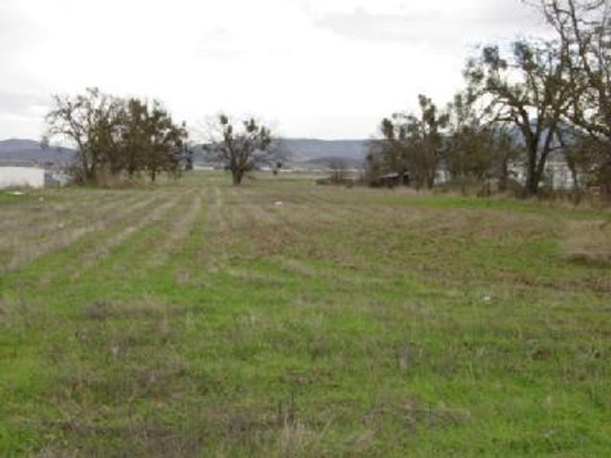 Level lot adjacent to airport.