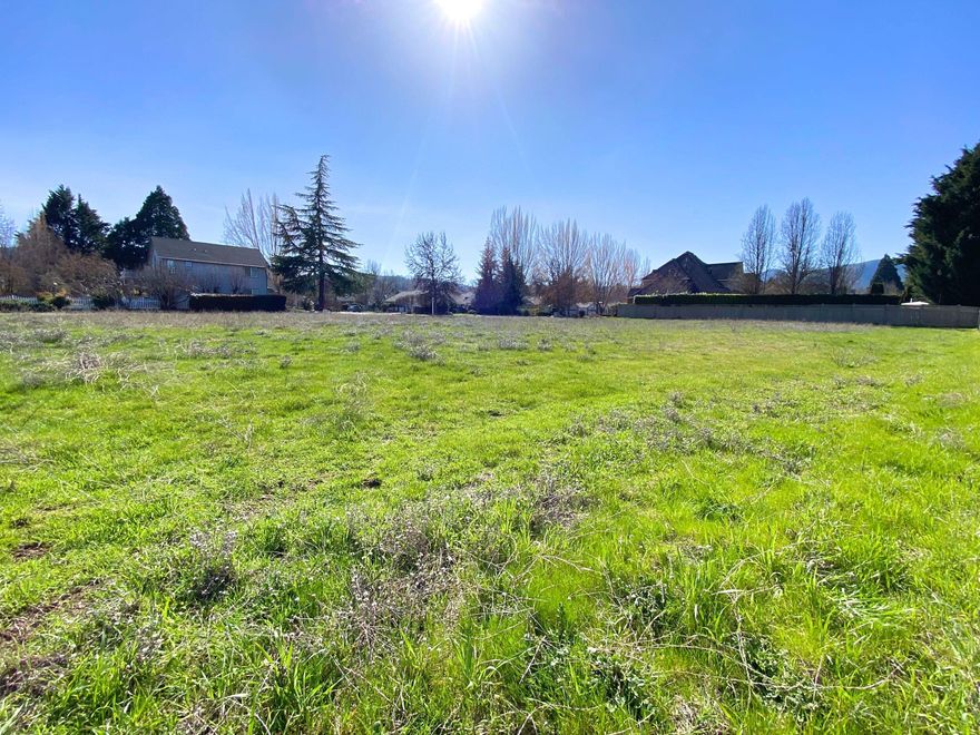 House Plans Available! Prime Residential Lot in Jacksonville - Last Available Parcel in Exclusive Neighborhood!  Discover this rare opportunity to build your dream home on the last available lot in this highly sought-after neighborhood of million-dollar homes. 2 story and/or single level home plans available w/ acceptable offer. Situated at the end of a quiet street, on the edge of town. This .64-acre parcel offers privacy and beauty with ''award winning'' Daisy Creek Vineyard as your neighbor. Located in the historic city of Jacksonville, this property is a short distance from the town's renowned attractions, charming shops, and fine dining options. A small community park located around the corner and access points to the many city-wide trails. This exceptional lot combines the tranquility of a private location with the convenience of proximity to both nature and culture, making it the perfect setting for your future home.