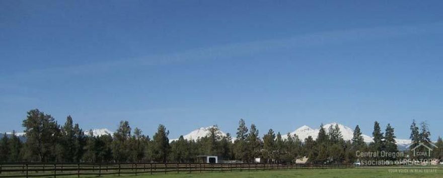 Breathtaking Cascade Mtn Views. Custom home. Master on main plus 1 other bedroom/sewing room. Great room with stunning kitchen. Office on main. Upstairs: 2 additional bedroom apt. 2nd 2248 sq ft guest home. 1.63 acres single wide with CUP for new home. Complete horse facility. 3 domestic wells. Massive masonry fireplace, built-in entertainment center & cabinets. Hickory hardwood flooring & designer amenities. A showplace!