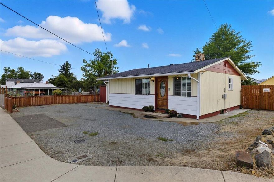 Charming Updated Cottage with Expansive Outdoor Living. With potential for multifamily, zoned MFR-20. This updated cottage-style home blends character with modern upgrades. Inside, you'll find new vinyl plank flooring and a beautifully remodeled bathroom. The massive, fully fenced backyard is a true retreat, featuring a giant gazebo for outdoor living, dedicated seating and entertainment areas, and lush landscaping perfect for gardeners. Two versatile outbuildings (10x8 and 8x9) provide additional storage or hobby space. Energy efficiency comes easy with solar panels, while recent improvements include exterior paint (2 years), a 4-year-old A/C, and a 5-year-old roof. With its inviting charm, thoughtful updates, and outdoor amenities designed for entertaining, this property is move-in ready and waiting to welcome you home!