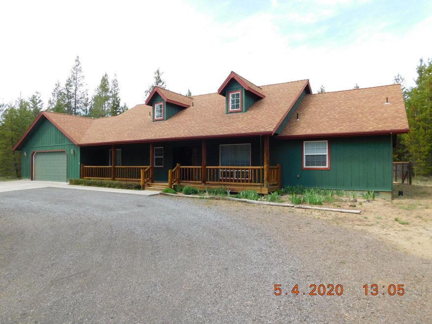 Beautiful Home is TRUE Northwestern Living at its best!! Features 2000sf single level home w/open floor plan, separation of master & 2 other bedrooms, 2 baths, master w/double sinks, huge soaking tub & separated shower. Attached double garage all located on these wonderful 2 acres on a paved road. Large kitchen with great lay out, eating bar with stools included, lots of cabinets & countertop space, curved archways add a great feel to this home w/a great flow, vaulted ceiling & rock fireplace. Eat in the adjoining formal dining room or at bay window with views of backyard. Formal dining room has also been used as an office/den and has a great dormer window skylight as does the main bathroom. Patio doors lead out from kitchen & master bedroom onto the back patio for a great place to entertain. Gorgeous hardwood floors with finishes & colors that blend w/Central Oregon. Really nice front porch with log accents, back patio, garden area & fenced backyard. Plenty of room for Shop or Barn.