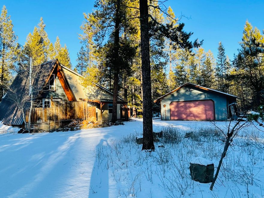 Cozy A-frame home built in 1976 with large addition in 2007 that has not been fully completed inside. Needs some TLC but this cutie has so much potential. Make this your perfect vacation getaway or full time home. 1.11 acre treed lot offers lots of privacy. Close to the lakes and mountains. Conveniently located close to town and Hwy 97, but not too close. There is a 24'x24' detached garage and other outbuildings. Has small detached bunkhouse which needs some TLC to be useable. Garden area in fenced in yard. Call your Realtor today to setup a showing.