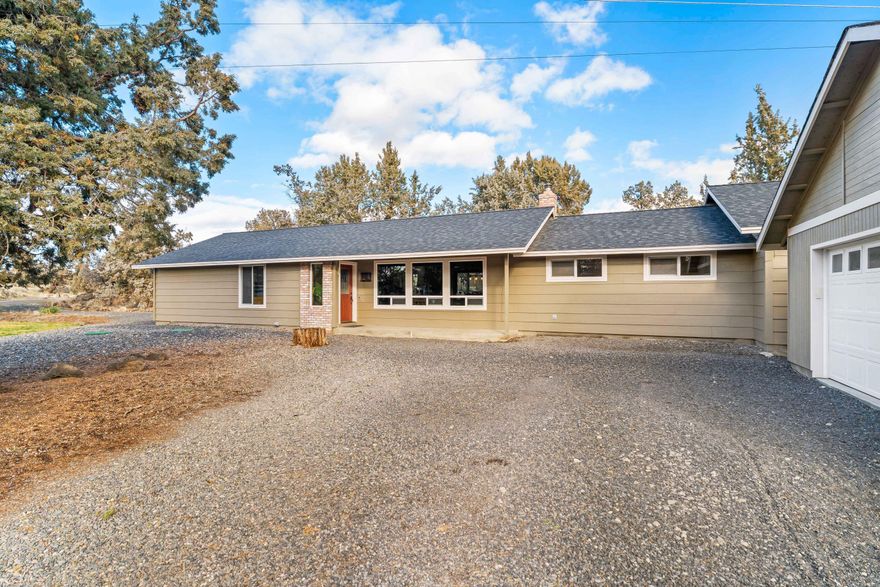 Unbeatable location between Terrebonne and Redmond! This inviting 2184 sqft, 3 bedroom, 2 bathroom home sits on over 4 acres which truly capture the essence of the Central Oregon lifestyle offering space, privacy, and everyday comfort. Enter into a bright great room featuring a cozy fireplace and sitting area, beautiful kitchen with granite tile counters, custom cabinets and slate flooring which extends through the dining area. Off the great room is a spacious living room, perfect for movie nights or gatherings. A generous bonus room with private access provides remarkable flexibility, ideal for a private home office, guest retreat, or multi-generational living. Outside you'll find tasteful landscaping, a covered concrete patio, and room to roam! Property has lots of character from rock outcroppings and old-growth juniper! Additional buildings include detached garage, greenhouse, and animal stalls + fencing.
