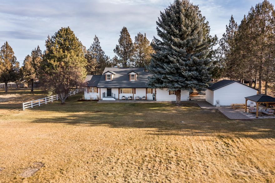 Enjoy private country living just minutes from Downtown Bend.  This newly remodeled 4 bedroom 2 ½ bath home with the primary bedroom on the main level has a light and bright living room, along with an office/den, pantry, mudroom, and three bedrooms upstairs. The large deck is great for entertaining family and friends or enjoying a quiet evening at the end of a busy day.  The 4 acres of irrigated pasture complete with pond provides privacy as well as a place for your horses or your children's 4H project. Located less than 4 miles from the nearest shopping center and just under 3 miles from St. Charles Hospital you can enjoy country living with all the comforts of living in town. Don't miss out, these opportunities don't come around very often.