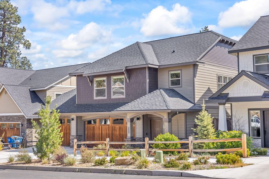 Discover this beautifully crafted 4-bedroom home with a spacious 3-car garage, nestled in one of NW Bend's most sought-after neighborhoods. Thoughtfully designed with an open floor plan, spacious great room with stone fireplace, gourmet kitchen with large island and pantry, and a luxurious primary suite with tile shower, soaking tub, and walk-in closet. Highlights include hand-textured walls, barn-wood garage doors, and under-cabinet lighting. The large backyard is perfect for entertaining, gardening, or simply unwinding with family and friends. Set in a quiet, secluded community, you'll enjoy peaceful surroundings while staying close to everything Bend has to offer. Just minutes from the stunning Riley Ranch Nature Reserve, the new Costco, Deschutes River trails, downtown Bend, and top-rated North Star Elementary. A rare opportunity to own a home that blends style, function, and location!