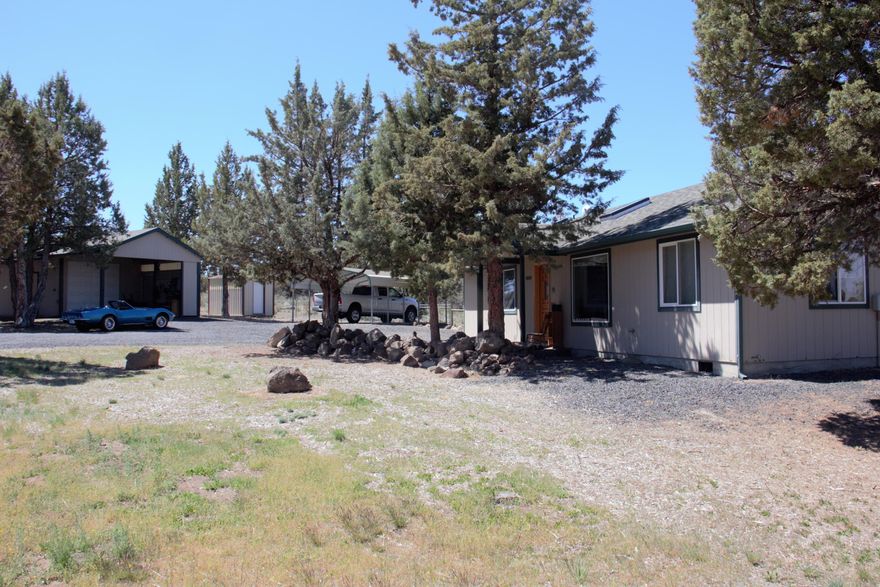 This charming 3 bedroom 2 bath open floor plan home is located on 1.8 acres of horse property. This is the perfect home for a family of outdoor enthusiasts looking for privacy and room to move. Featuring private access to BLM that opens up all the way to the Crooked River, yet only 15 minutes from town. Property features a beautiful natural setting with amazing views of the Cascade Mountains. Lots of storage with an amazing heated and insulated 800 sq. ft. shop, featuring also, a separate office and a pellet stove. Along with 3 other storage buildings. Electric gate with opener.