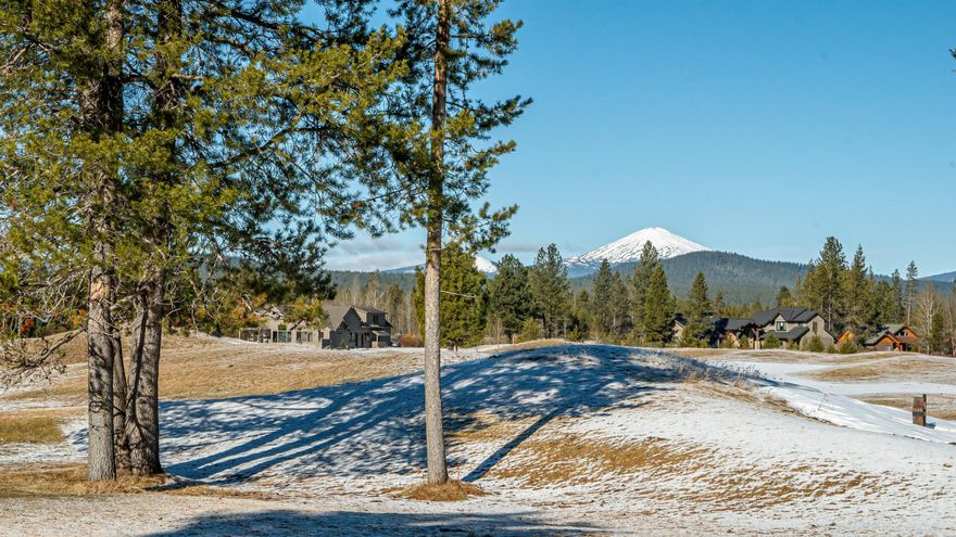 Here is a rare opportunity to own one of the most desirable views in Caldera Springs. A panoramic view of Caldera Links, the Cascade foothills and Mount Bachelor. The Great Room, kitchen, dining area, den/office, a powder room and Primary Suite are on the main floor. All of which spills out to private patio with built-in BBQ and gas firepit. Upstairs, there is a bonus room, a bunk area, two more suites and another powder room. Attention to detail can be found throughout the home from hammered copper sink and hood and Wolf 6-burner range in the kitchen to a wonderful, deep soaking tub in the spa-like Primary bath. Caldera Springs carries on the rich Sunriver legacy and now, with the eastern expansion underway, more amenities will be coming online over the next year or two. Central Oregon is a place that dreams are made of and memories are made. Call today for private showing.