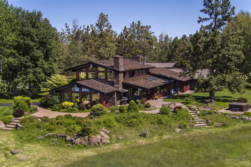 Stunning, unobstructed Cascade Mountain Views from NW Style Home in Tumalo. Park like setting on 7.6 acres with 5.8 acres of Swalley irrigation water rights and pond. Custom Home is 4595 sf, 4 bedrooms,4 bathrooms, living room with woodburning fireplace, family room, master suite with office, 4th bedroom is attached accessed through 3 car garage with a gear room/guest suite, hot tub. Private setting, wonderful outdoor living, landscaped, flagline lot, paved driveway and minutes from Bend.