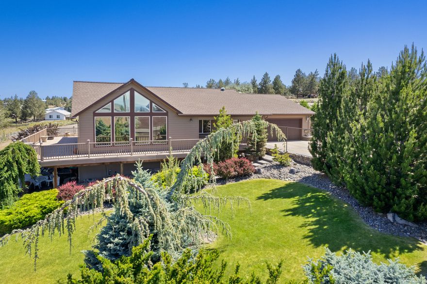 This home has spectacular panoramic views of the Cascade Mountain Range! Located in the popular Crooked River Ranch community.  You will love this 2 bedroom, plus office, 2 bathroom single level home on 1.15 acres of completely fenced in property.  There is an 864 sqft shop that has room to store an RV!  Favorable horse property as well! There is a full RV hookup.  The front yard has been beautifully landscaped with a sprinkler system.  There is a soothing water feature that greets you when you walk up to the front door.  This home has a great open floor plan with vaulted ceilings. Wall to wall windows to enjoy the breathtaking mountain views. The windows have custom treatments.  The kitchen has stainless steel appliances with a double oven.  Enjoy the views and entertaining on the wrap  around Trex deck. Crooked River Ranch has a community pool, golf, trails, tennis/pickle ball courts and much more! This beautiful home will not last long! Come see for yourself.