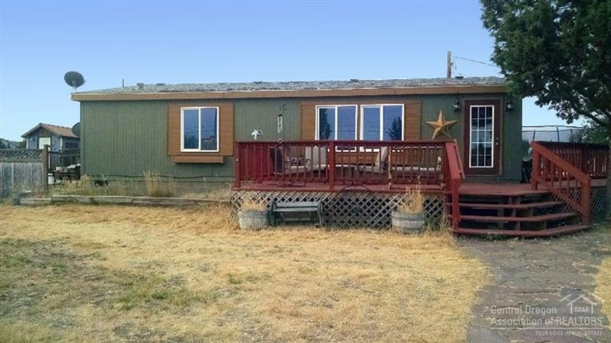 Enjoy all the amenities and recreational opportunities Crooked River Ranch has to offer! This home is a great fixer-upper, with a ton of potential. Very versatile living space. Acreage fenced and crossed-fenced, set up for horses and livestock. Gated entry to community property and walking/riding trails. Tack shed, barn with loft, tool & garden sheds.