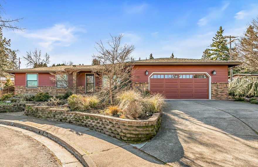 Nicely updated and beautifully maintained, this single-level home offers mountain views from the living room, all tucked away on a quiet cul-de-sac. Recent upgrades include solar panels & new windows for bright, energy-efficient living. The spacious kitchen features generous counter space, abundant cabinetry, pantry, quartz countertops & new tile backsplash. The kitchen flows into the dining area and family room, where you'll find new gas logs & built-in shelving, a warm & inviting space for everyday living. Bamboo flooring throughout with new LVP flooring in the bedrooms. The primary suite includes a beautifully updated ensuite bath with a custom tile shower.  Slider to the lovely backyard complete with a covered patio and soothing water feature. The low-maintenance landscaping offers both drip irrigation and sprinklers with TID.  It's the perfect setting for entertaining or simply relaxing. Ideally located close to shopping, downtown, and I-5. Come experience the charm of this home