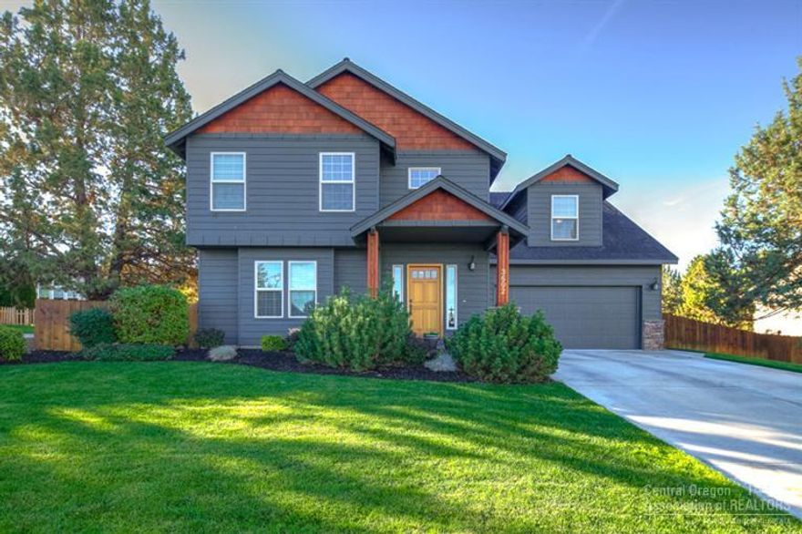 Back on Market @no fault of home! Spacious 3 bedroom home w/ huge Bonus room or 4th bedroom. Comfortable Custom floor plan w/hardwood trim package & peek-a-boo mountain views. Hardwood floors in the kitchen & tiled counters throughout. Gas fireplace in living area for cozy evenings. Vaulted Master Suite w/ceiling fan & ample closet space. Carpets are clean, paint is touched up & move in ready! Tons of storage, indoor/outdoor dog kennel for pets. Property is fenced, beautifully landscaped w/auto sprinklers.