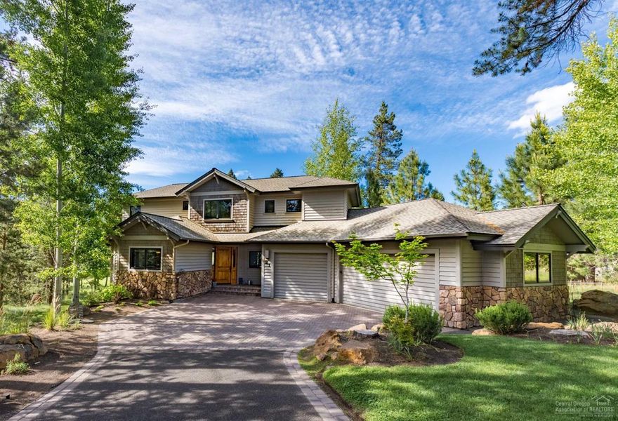 Gorgeous custom SunForest built home with breathtaking views of Woodlands Golf Course & fairway ponds. Quality abounds in this exceptional home w/stone gas fireplace, vaulted open beam ceilings, wall of windows, wide plank hardwood flrs., gourmet kitchen w/granite, knotty alder cabinetry, pantry, center isle, wet-bar, 4 bedrooms, 5.5 baths, 4 master suites, bonus room, loft/office, billiard room, wine cellar, shop, A/C, 3 car garage w/workbench & tons of storage. Enjoy relaxing on the elevated paver patio.