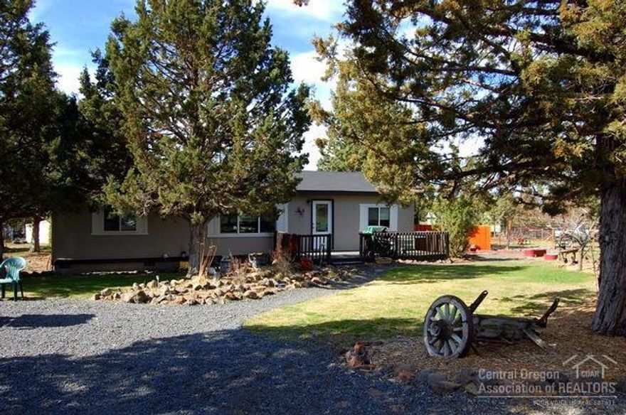 Rural acreage ready for your horses. 1.83 acres with new 36x36 barn, 3 stalls, tack room with storage above and hay storage for 5 ton hay. Property also offers loafing shed with 3 bays, shop, storage shed and dog run. Country barnwood accents throughout this 2000 Fuqua home. 3bd, 2ba, 1296sf, newer windows, doors, vinyl and laminate floors and heat pump with ac. Fenced and cross fenced with circular gated entry.